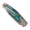 El Rey™ Damasteel Button Lock — Santa Fe Stoneworks Kingman Turquoise with black matrix, back