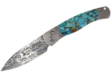 El Rey™ Damasteel Button Lock — Santa Fe Stoneworks Kingman Turquoise with black matrix, open, blade down