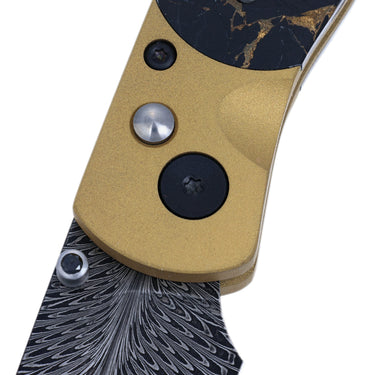 El Rey Feather Damascus Button Lock – Black Buffalo Bronze, Gold Cerakote & Black PVD Hardware, Black Diamond Thumb Stud — close-up
